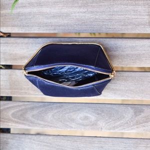 small, petite wrist bag.